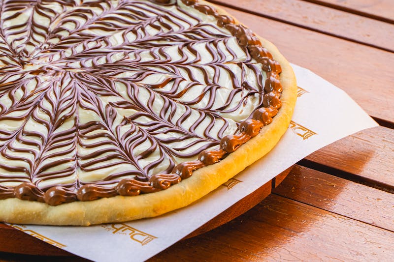 Nutella dessert pizza with strawberries and powdered sugar